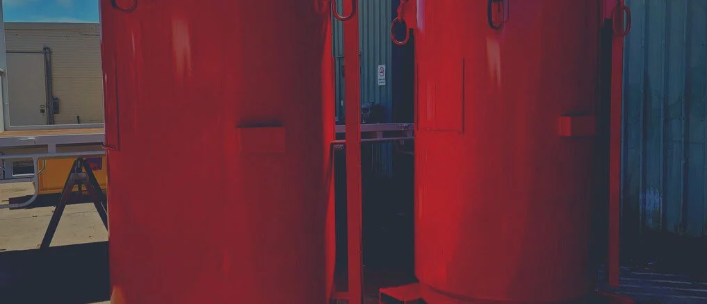 Red protective coating applied to industrial vessels