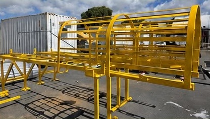 Bright yellow coated industrial frames outdoors